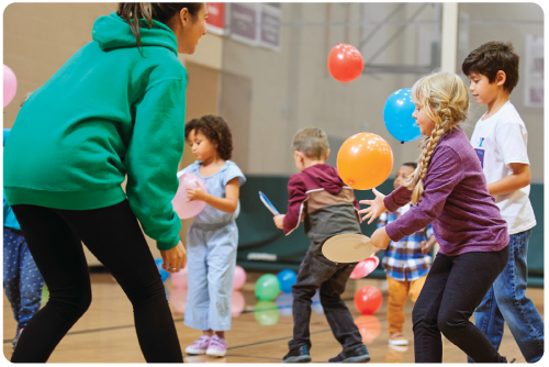 Kids playing with Balloons YMCA