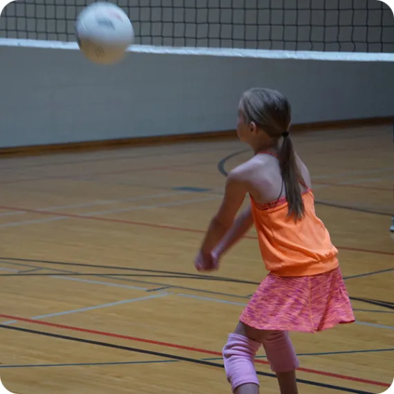 young girl playing volleyball